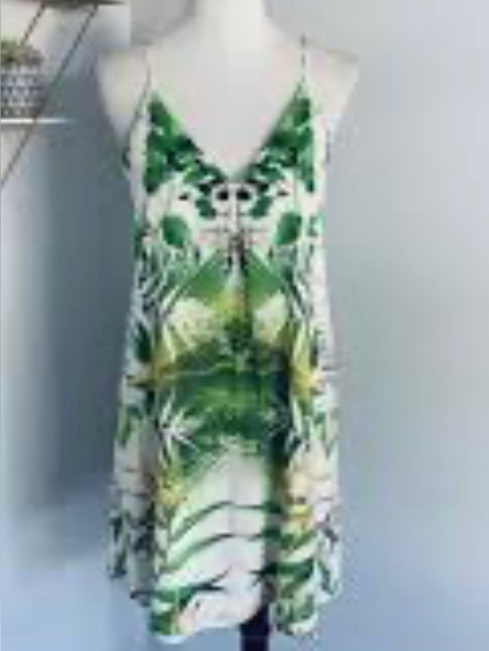 Alice and Olivia Fierra mini dress
Palm print spaghetti strap racer back